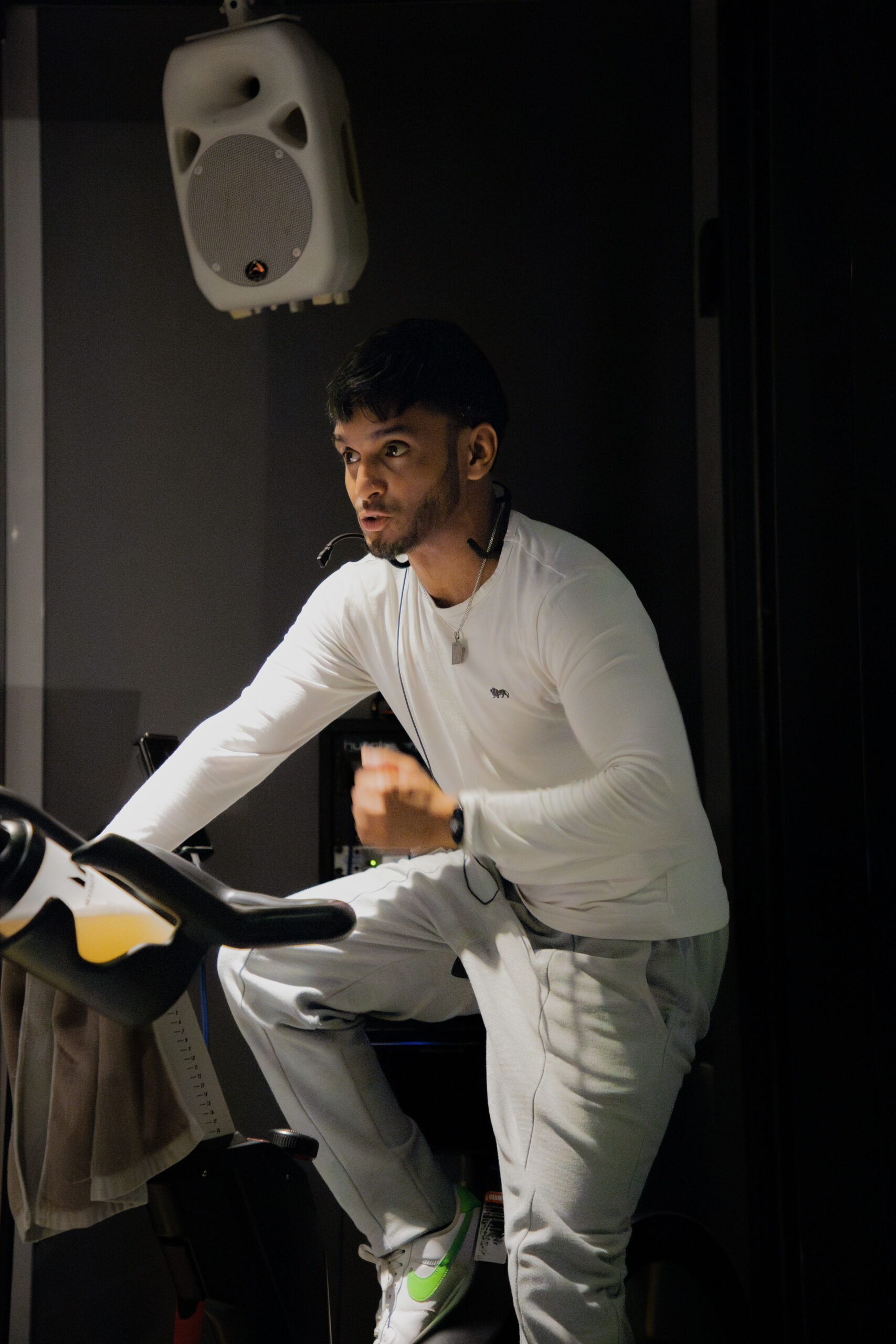 Afsar Ali, founder of Muted Healing instructing a BollyBike cycling class.